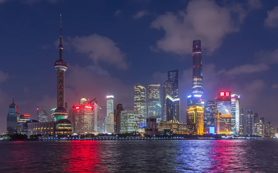 Shanghai’s illuminated Pudong skyline across the Huangpu River